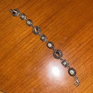 Gorgeous multi stone bracelet set in silver. Reversible!